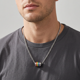 AI-generated lifestyle image of a man wearing the Rainbow Orbit Barrel Necklace