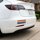 Mockup of the rainbow sticker on the bumper of a white Tesla