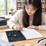 Student taking notes in a library