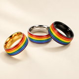 Three rainbow rings on an ivory background